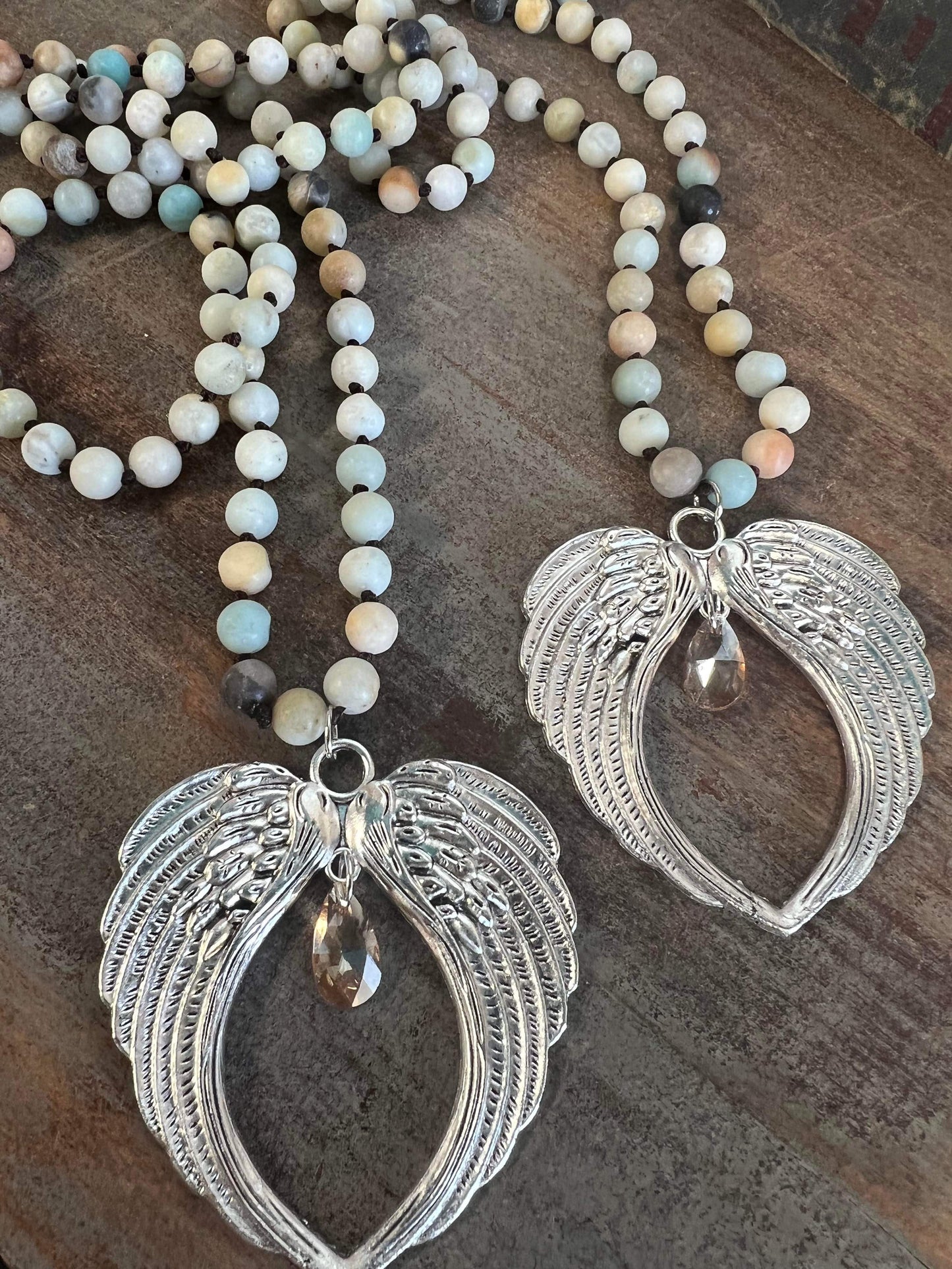 Natural stone bead with Angel wings pendant